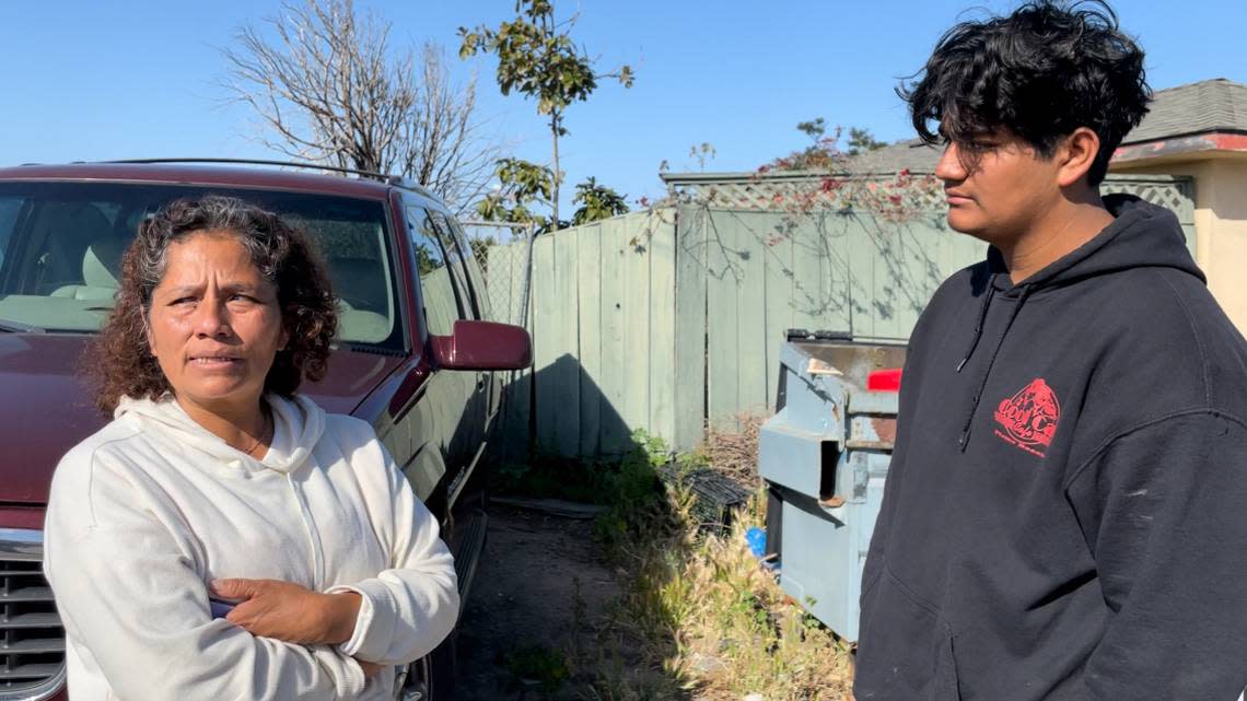 Los Tamales Poblanos Mexican Food owner Rosalba Rodriguez, left, stands with Antonio Hernandez the morning after a fire destroyed the restaurant. 5 Cities Fire Authority and Cal Fire extinguished the fire on Front Street in Oceano early Friday morning, May 12, 2023.