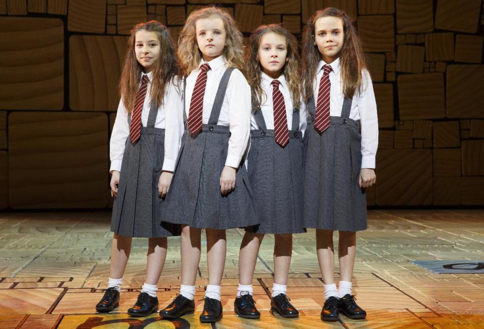 This theater publicity image released by Boneau/Bryan-Brown shows the four actresses who share the title role in "Matilda The Musical," from left, Bailey Ryon, Milly Shapiro, Sophia Gennusa, and Oona Laurence on stage at the Shubert Theatre in New York. (AP Photo/Boneau/Bryan-Brown, Joan Marcus)