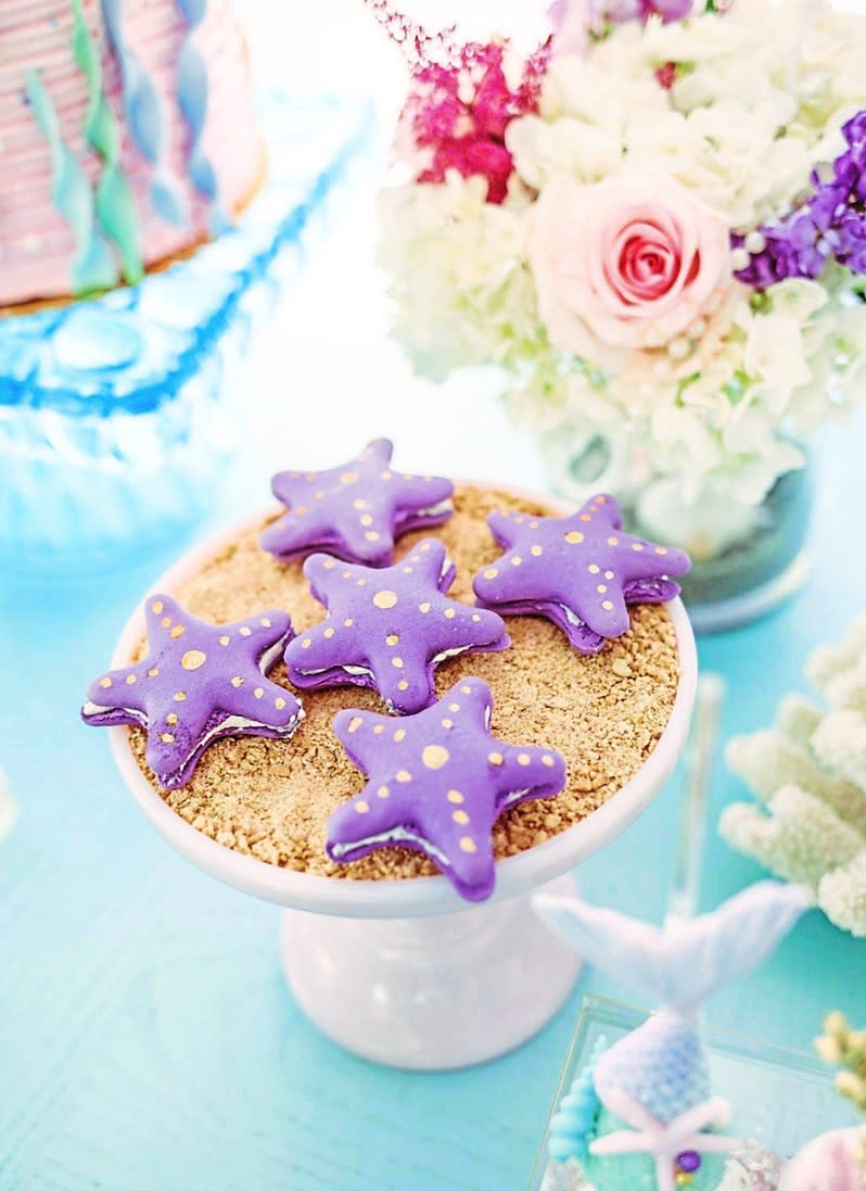 Starfish-shaped cookie desserts on table at mermaid party