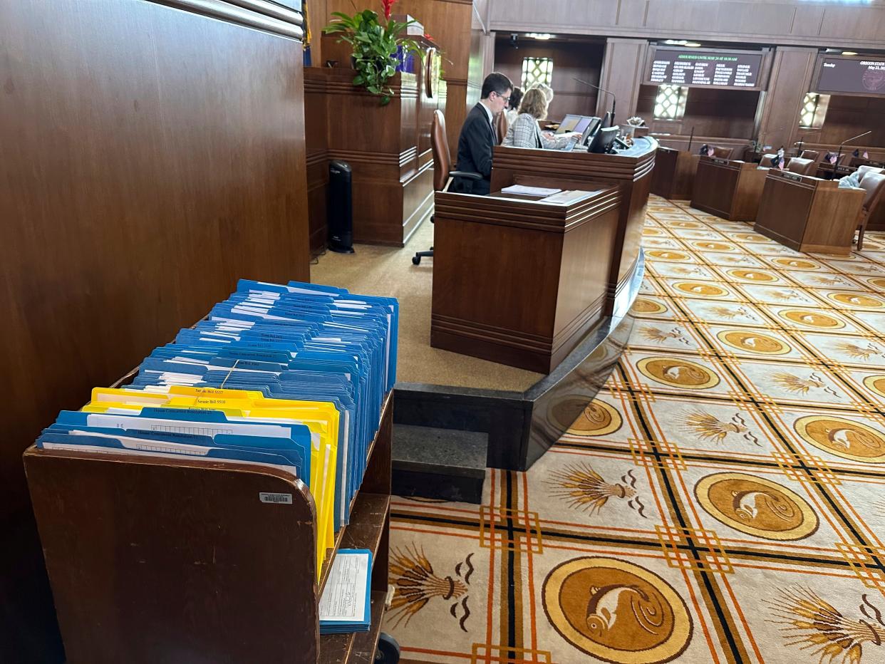 Hundreds of bills awaiting action in the Oregon Senate are held in a battered bookshelf on the Senate floor, unable to move forward to a vote because of a protest by Republicans.