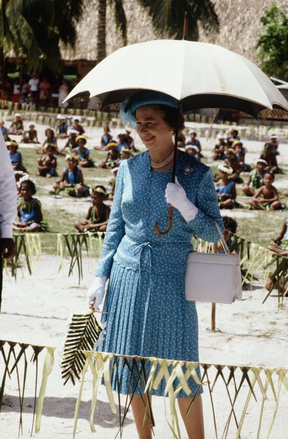 <p>During a visit to Tuvalu, the Queen made sure to stay out of the beaming sun. <br></p>