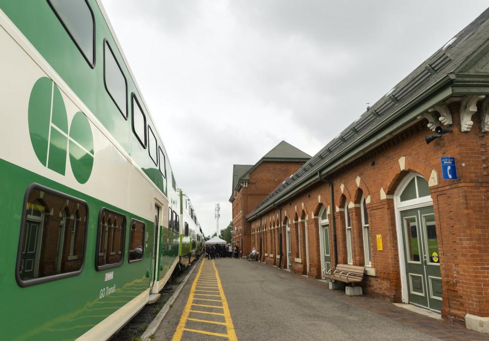 A GO Transit train sits parked at the Niagara Falls train station in August 2022. The public transit challenges of urban-adjacent communities are different than those of rural areas. THE CANADIAN PRESS/Tara Walton