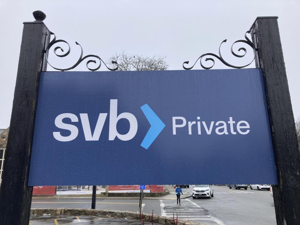 A Silicon Valley Bank sign is shown outside branch in Wellesley, Mass on Saturday, March 11, 2023. Regulators have seized the assets of one of Silicon Valley’s top banks, marking the largest failure of a U.S. financial institution since the height of the financial crisis almost 15 years ago. (AP Photo/Peter Morgan)