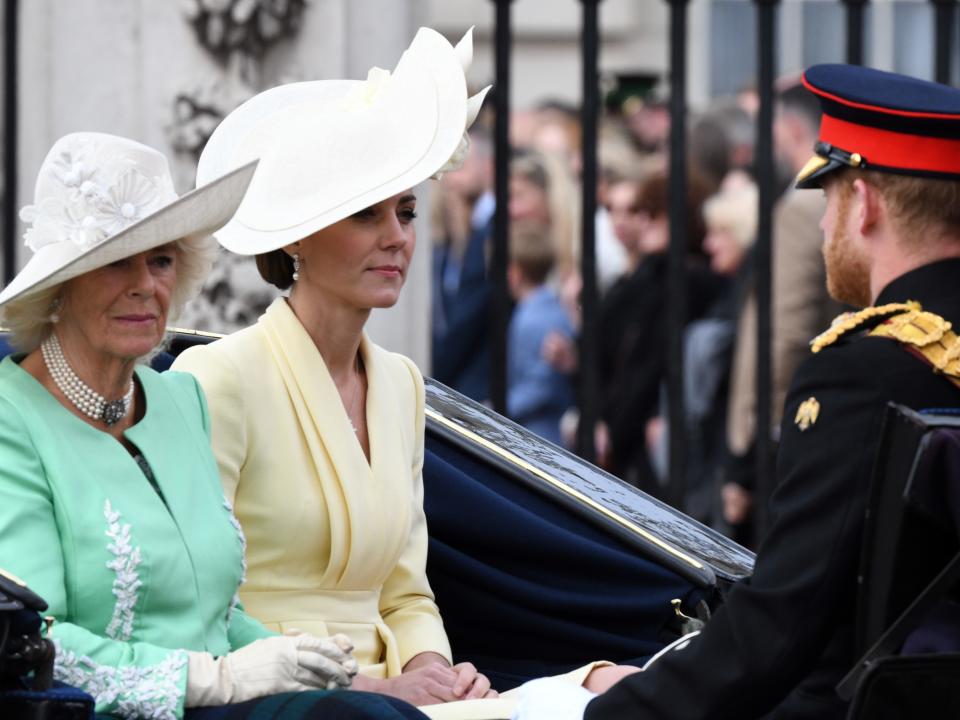 Prince Harry, Camilla, Meghan Markle, and Kate Middleton ride in an open carriage as they attend Trooping the Colour on June 8, 2019