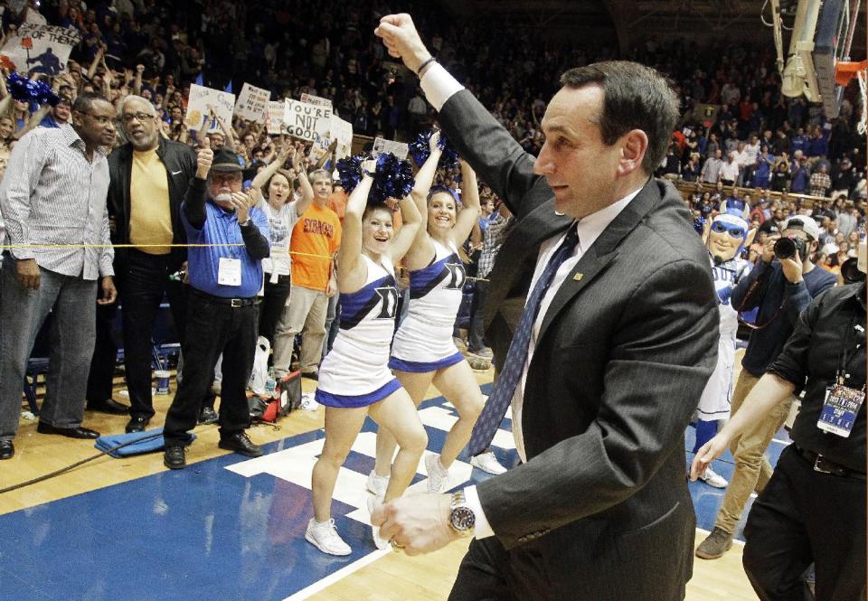 Duke coach Mike Krzyzewski celebrates following Duke's 66-60 win over Syracuse in an NCAA college basketball game in Durham, N.C., Saturday, Feb. 22, 2014. (AP Photo/Gerry Broome)