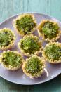 <p>These savory tartlets are inspired by flavors of the Mediterranean. Reminiscent of Greek spanakopita, they combine spinach, feta cheese, and fresh dill in a crunchy phyllo dough shell.</p><p><em><strong><a href="https://www.womansday.com/food-recipes/food-drinks/recipes/a39895/feta-spinach-tartlets-recipe-ghk0414/" rel="nofollow noopener" target="_blank" data-ylk="slk:Get the Feta and Spinach Tartlets recipe;elm:context_link;itc:0;sec:content-canvas" class="link ">Get the Feta and Spinach Tartlets recipe</a>.</strong></em><br></p>