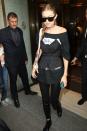 <p>In an H&M pinstripe corset over an oversized graphic tee, black leather leggings, lace-up boots, a netted choker, a personalized Fendi bag and rectangular Max Mara sunglasses after <a href="https://www.harpersbazaar.com/fashion/models/news/a17802/gigi-hadid-fights-off-man-at-milan-fashion-week/" rel="nofollow noopener" target="_blank" data-ylk="slk:defending herself from a stranger;elm:context_link;itc:0;sec:content-canvas" class="link ">defending herself from a stranger</a> in Milan. </p>