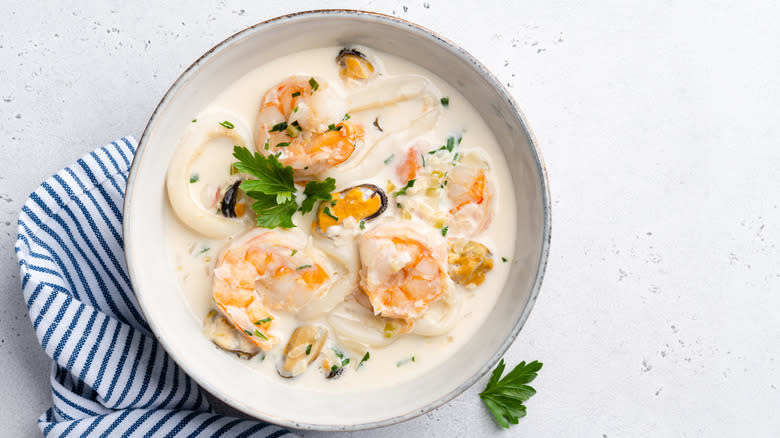 seafood stew in a white bowl