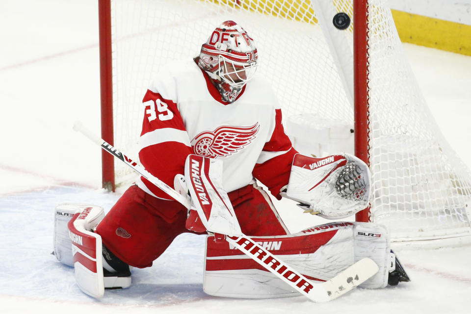 Detroit Red Wings goaltender Alex Nedeljkovic (39) makes a save during the third period of an NHL hockey game against the Buffalo Sabres, Monday, Jan. 17, 2022, in Buffalo, N.Y. (AP Photo/Jeffrey T. Barnes)