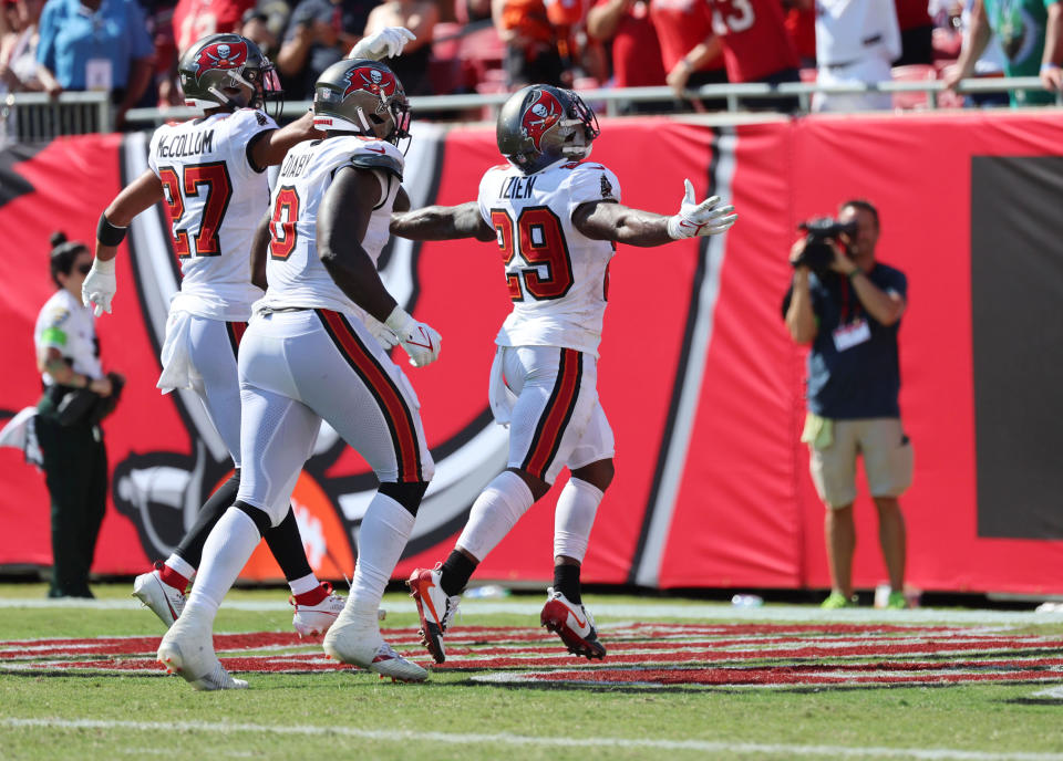 Sep 17, 2023; Tampa, Florida, USA; Tampa Bay Buccaneers safety <a class="link " href="https://sports.yahoo.com/nfl/players/40681" data-i13n="sec:content-canvas;subsec:anchor_text;elm:context_link" data-ylk="slk:Christian Izien;sec:content-canvas;subsec:anchor_text;elm:context_link;itc:0">Christian Izien</a> (29) celebrates his interception against the Chicago Bears during the second half at Raymond James Stadium. Mandatory Credit: Kim Klement Neitzel-USA TODAY Sports