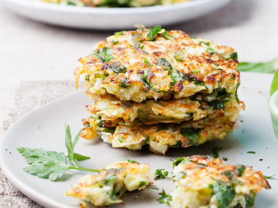 spinach pancakes with yogurt dressing with fresh herbs.