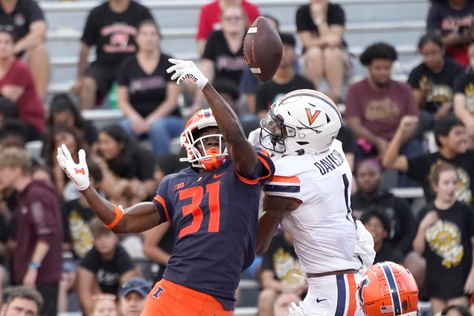 Illinois defensive back Devon Witherspoon breaks up a pass in the end zone intended for Virginia's Lavel Davis Jr. on Sept. 10, 2022, in Champaign, Illinois.