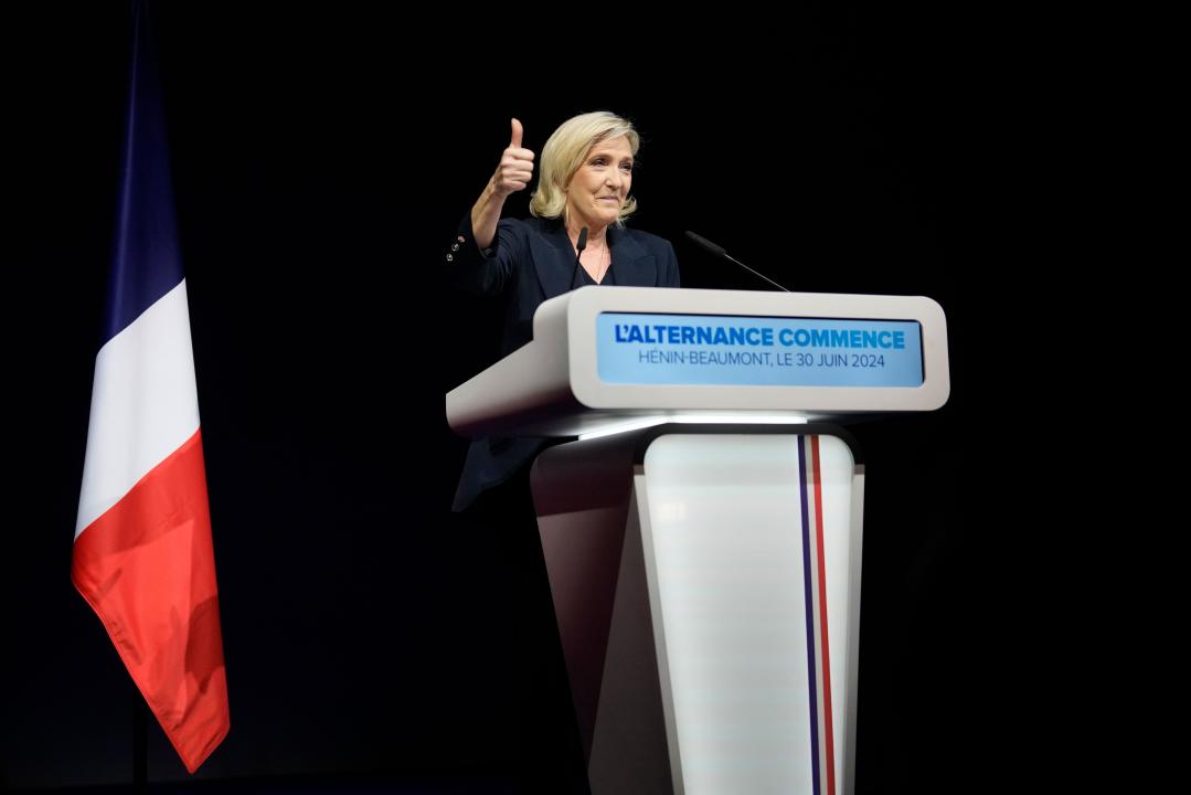 French far right leader Marine Le Pen thumbs up as she delivers her speech after the release of projections based on the actual vote count in select constituencies , Sunday, June 30, 2024 in Henin-Beaumont, northern France. French voters propelled the far-right National Rally to a strong lead in first-round legislative elections Sunday and plunged the country into political uncertainty, according to polling projections. (AP Photo/Thibault Camus)