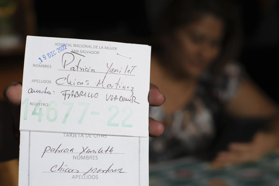 Transgender man Fabricio Chicas holds his Women’s National Hospital user card, filled out with his given name, Patricia Yamileth Chicas Martinez, during an interview in his home in San Salvador, El Salvador, Sunday, April 30, 2023. In hospitals, Chicas said, nurses have made fun of him. Since Chicas still requires gynecological consultations, health personnel often call him by the female name on his ID or have delayed his appointments, claiming that they cannot treat “people like him.” (AP Photo/Salvador Melendez)