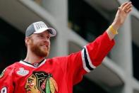 Jun 18, 2015; Chicago, IL, USA; Chicago Blackhawks left wing Bryan Bickell (29) acknowledges the crowd during the 2015 Stanley Cup championship parade and rally at Soldier Field. Mandatory Credit: Jon Durr-USA TODAY Sports