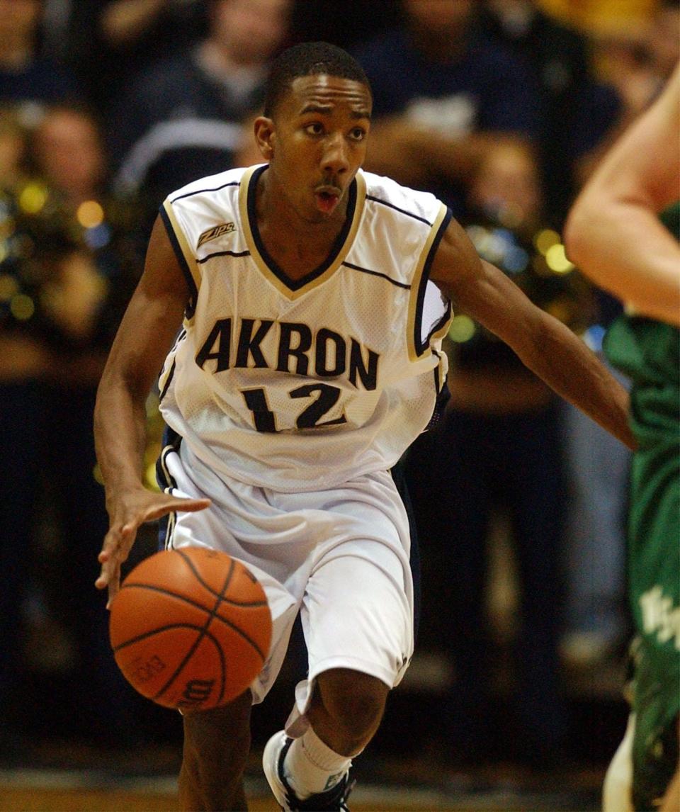 Akron's Dru Joyce III handles the basketball at Rhodes Arena, Dec. 30, 2003.