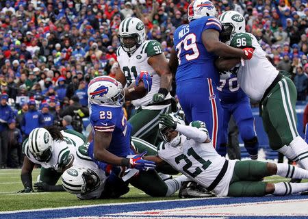 Jan 3, 2016; Orchard Park, NY, USA; Buffalo Bills running back Karlos Williams (29) scores a touchdown against the New York Jets during the first half at Ralph Wilson Stadium. Mandatory Credit: Kevin Hoffman-USA TODAY Sports