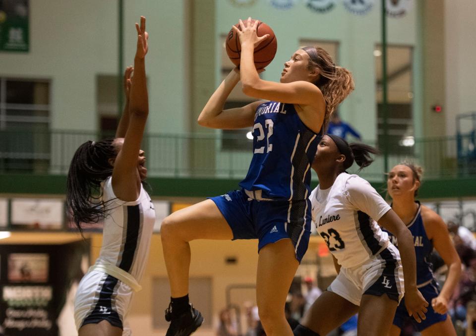 Memorial’s Myla Browning (22) takes a shot as the Memorial Tigers play the La Lumiere Lakers during the 2022 Evansville North Showcase at North High School in Evansville, Ind., Friday, Dec. 2, 2022. 