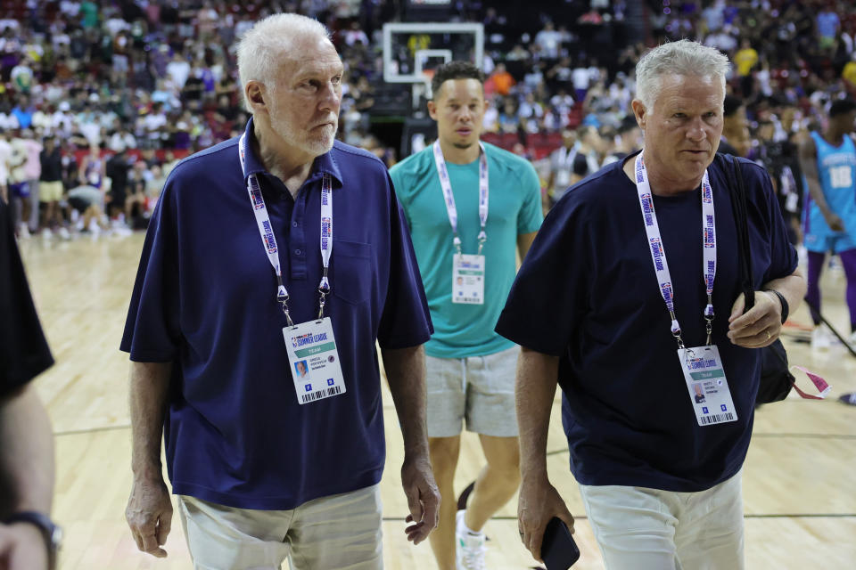 LAS VEGAS, NEVADA - JULY 07: Head coach Gregg Popovich (L) and assistant coach Brett Brown of the San Antonio Spurs leave the court following the victory against the Charlotte Hornets at the Thomas & Mack Center on July 07, 2023 in Las Vegas, Nevada. (Photo by Ethan Miller/Getty Images)