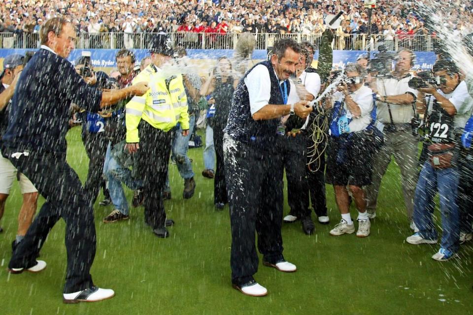 Champagne moment: Torrance celebrates after leading Europe to victory in 2002 (AFP/Getty Images)