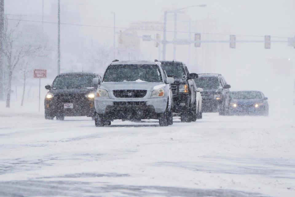 Drivers make their way along a road during a winter storm in Oklahoma City. Source: AP