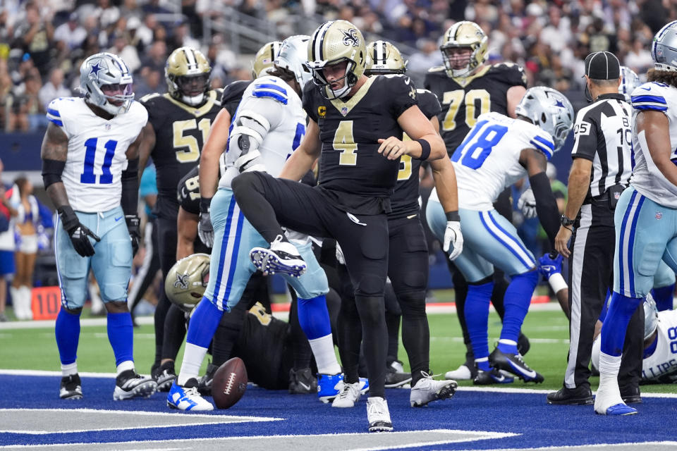 New Orleans Saints quarterback Derek Carr reacts after scoring on a keeper against the Dallas Cowboys during the first half of an NFL football game, Sunday, Sept. 15, 2024, in Arlington, Texas. (AP Photo/Tony Gutierrez)