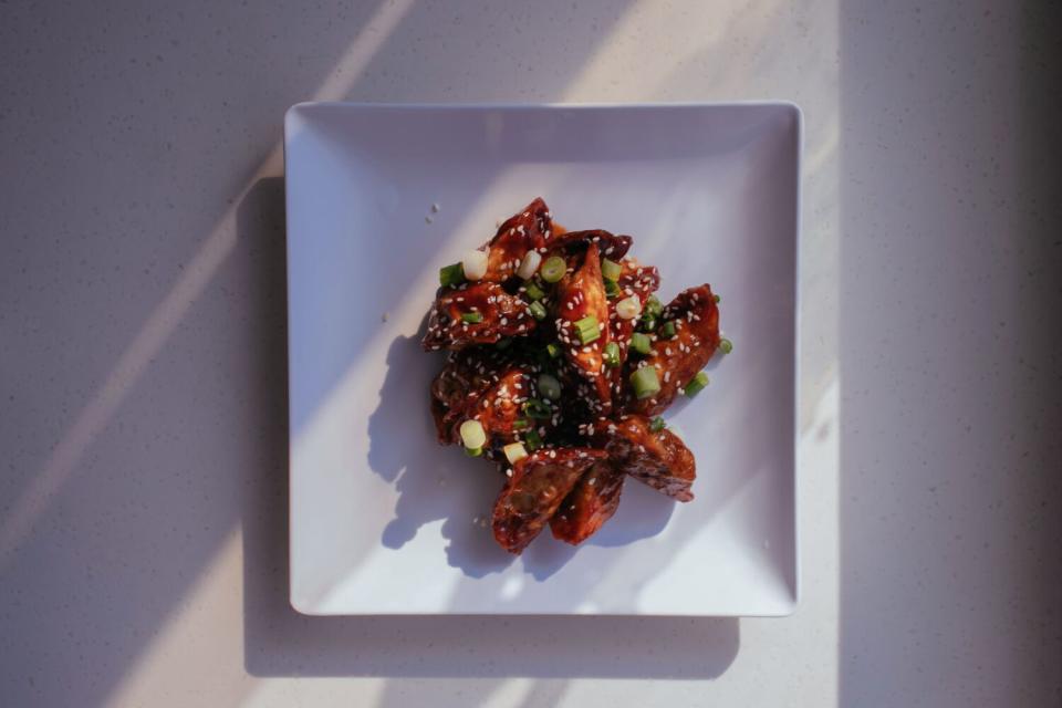 Barbecue fried dumplings on a white plate.