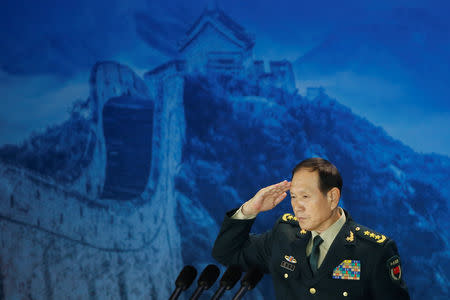Chinese Defence Minister Wei Fenghe salutes after addressing the Xiangshan Forum in Beijing, China October 25, 2018. REUTERS/Thomas Peter