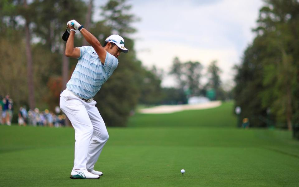  Hideki Matsuyama of Japan plays his shot from the 18th tee during the third round  - Getty Images