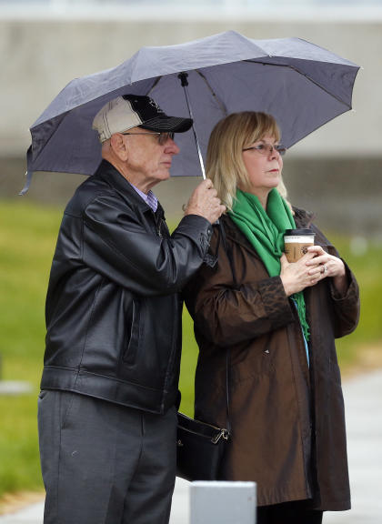 Lonnie and Sandy Phillips, whose daughter, Jessica Ghawi, was killed in the theater shooting, arrive for court on Monday. (AP/Brennan Linsley)