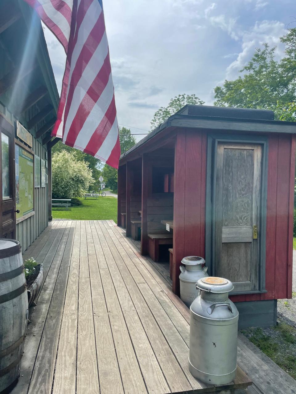 Train-car themed benches at the Cambridge Junction trailhead.