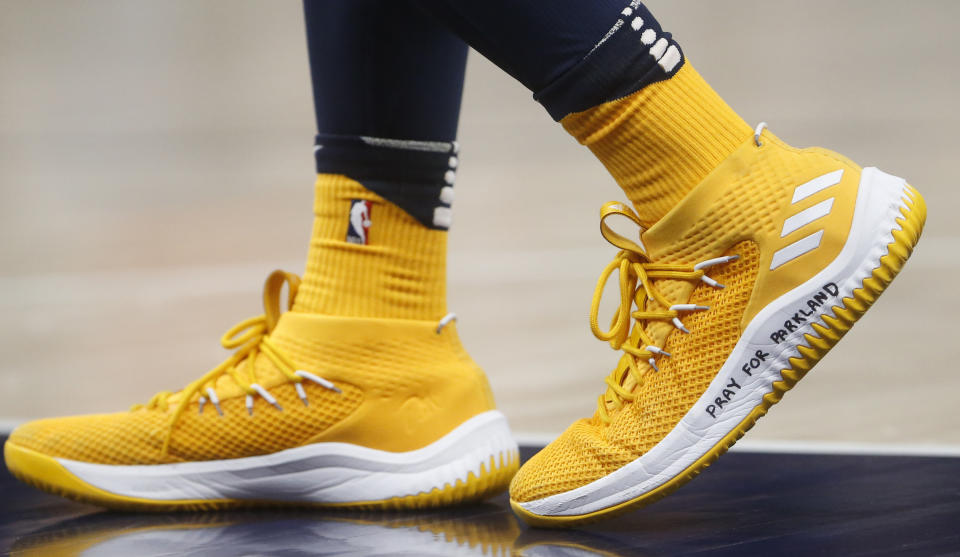 Utah Jazz guard Donovan Mitchell wears a shoe with “Pray for Parkland” written on it, during the second half of the team’s NBA basketball game against the Phoenix Suns on Wednesday, Feb. 14, 2018, in Salt Lake City. (AP Photo/Rick Bowmer)