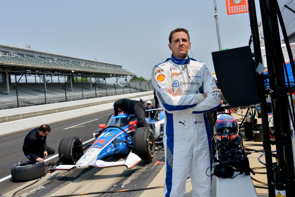 Stefan Wilson stands by his pit box during a practice session the 2023 Indianapolis 500 on May 17.