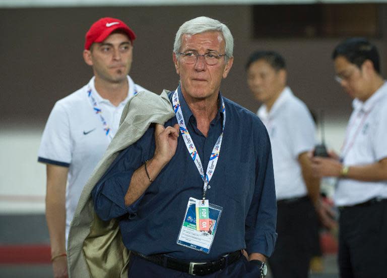 Guangzhou Evergrande Italian coach, Marcello Romeo Lippi (C), pictured during an AFC Champions League semi-final, between China's Guangzhou Evergrande and Japan's Kashiwa Reysol, in Tianhe Sport Center in Guangzhou, on October 2, 2013