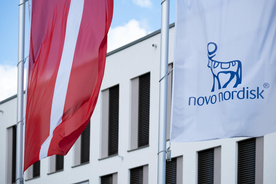 Novo Nordisk advertising flags and logo on the facade, Danish pharmaceutical giant Novo Nordisk AS, production of innovative medicines, obesity treatment Ozempic, Mainz, Germany, June 15, 2024