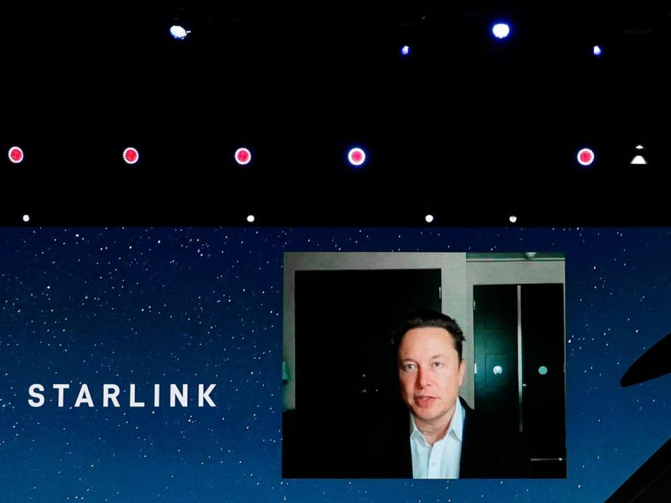SpaceX founder Elon Musk on a video stage speaking about Starlink