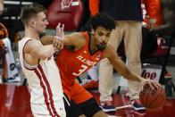 Illinois's Jacob Grandison tries to get past Wisconsin's Tyler Wahl during the second half of an NCAA college basketball game Saturday, Feb. 27, 2021, in Madison, Wis. (AP Photo/Morry Gash)