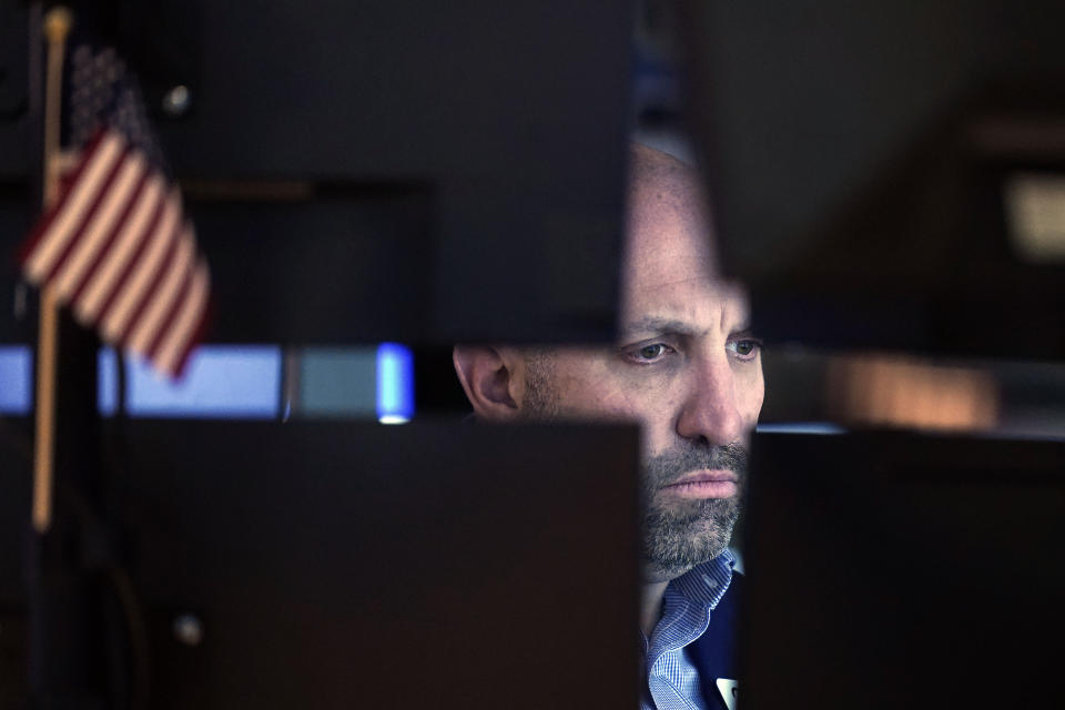 Specialist James Denaro works at his post on the floor of the New York Stock Exchange, Dec. 1, 2021. Stocks are opening mostly higher on Wall Street, led by gains in airlines and other travel-related companies that would benefit from more reopening of the economy. The S&P 500 edged up 0.1% in the early going Monday, Dec. 6, 2021 and the Dow Jones Industrial Average rose 0.9%. (AP Photo/Richard Drew)