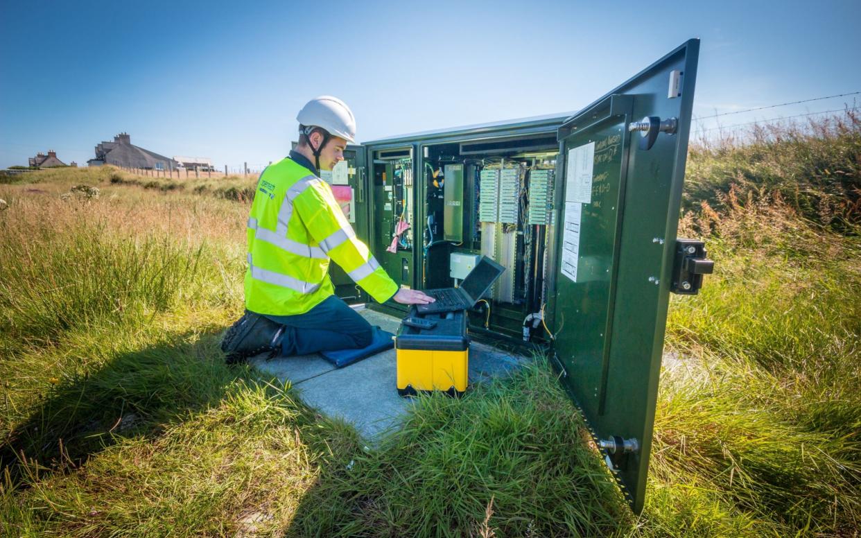 Engineer Stuart MacDonald in North Tolsta, as the remote community in the Western Isles is the first in Scotland to test increased broadband speeds over long phone lines - PA