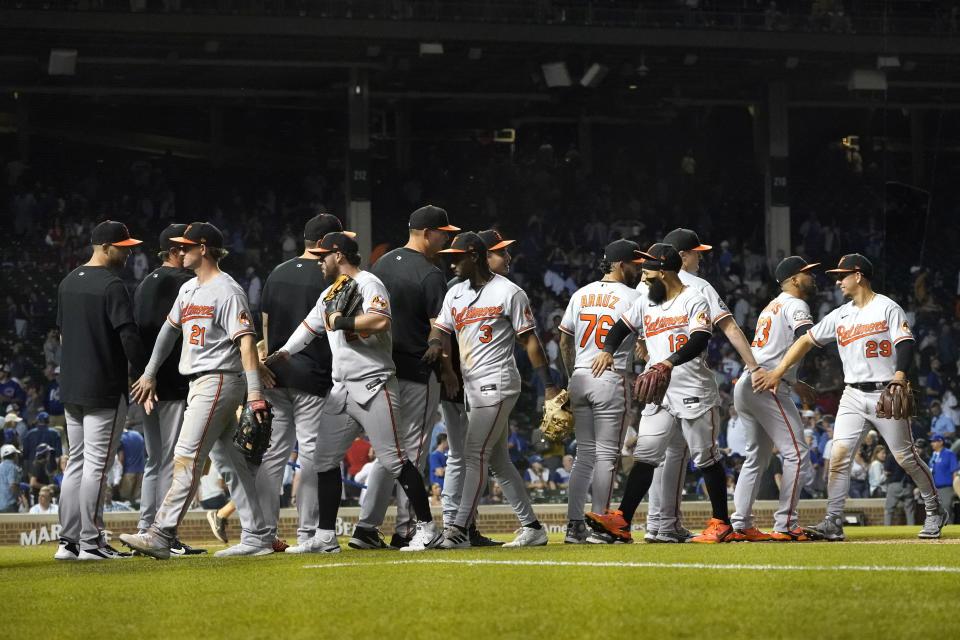 The Baltimore Orioles celebrate their ninth win in a row with a 4-2 decision over the Chicago Cubs after a baseball game Tuesday, July 12, 2022, in Chicago. (AP Photo/Charles Rex Arbogast)