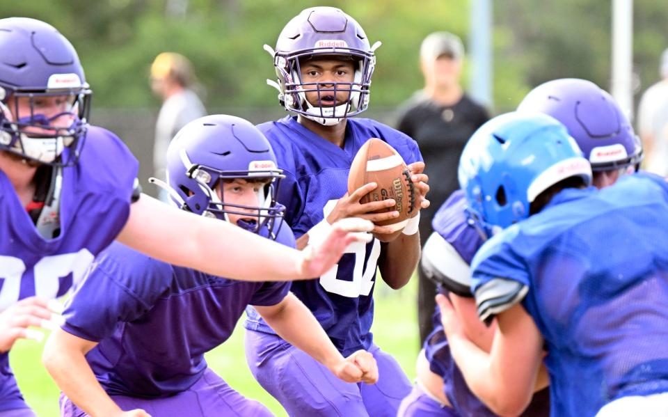 Martha's Vineyard quarterback TJ Lett looks for receiver against Upper Cape Tech Tuesday in Mashpee.