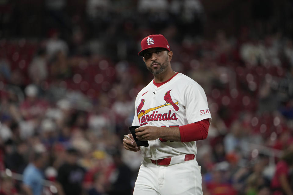 St. Louis Cardinals manager Oliver Marmol walks back from the mound after making a pitching change during the ninth inning of a baseball game Monday, May 6, 2024, in St. Louis. (AP Photo/Jeff Roberson)