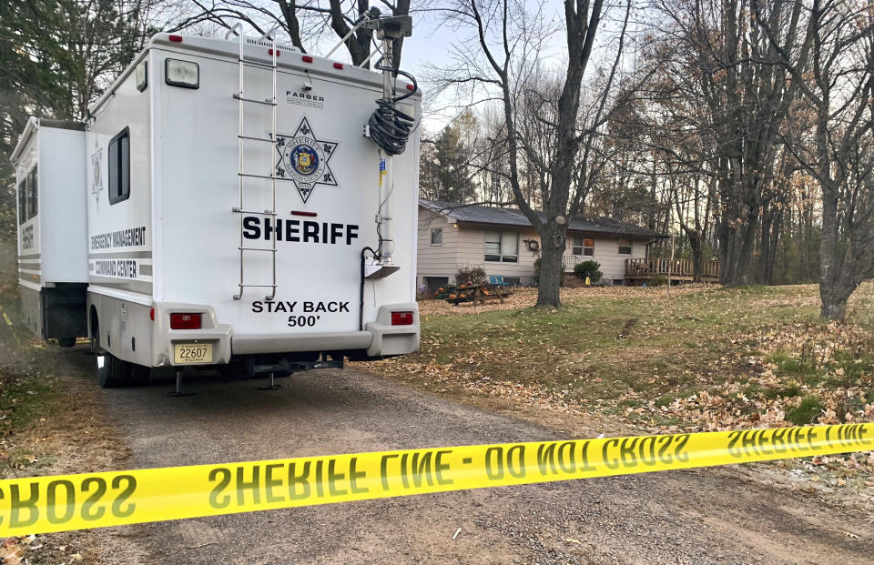 FILE - In this Oct. 23, 2018, file photo, a Barron County, Wis., sheriff's vehicle is parked outside the home where James Closs and Denise Closs were found fatally shot on Oct. 15. A search to find the couple's missing 13-year-old daughter Jayme continues. The FBI is examining additional surveillance video taken from an expanded area around the home. Investigators believe Jayme was abducted. (AP Photo/Jeff Baenen, File)