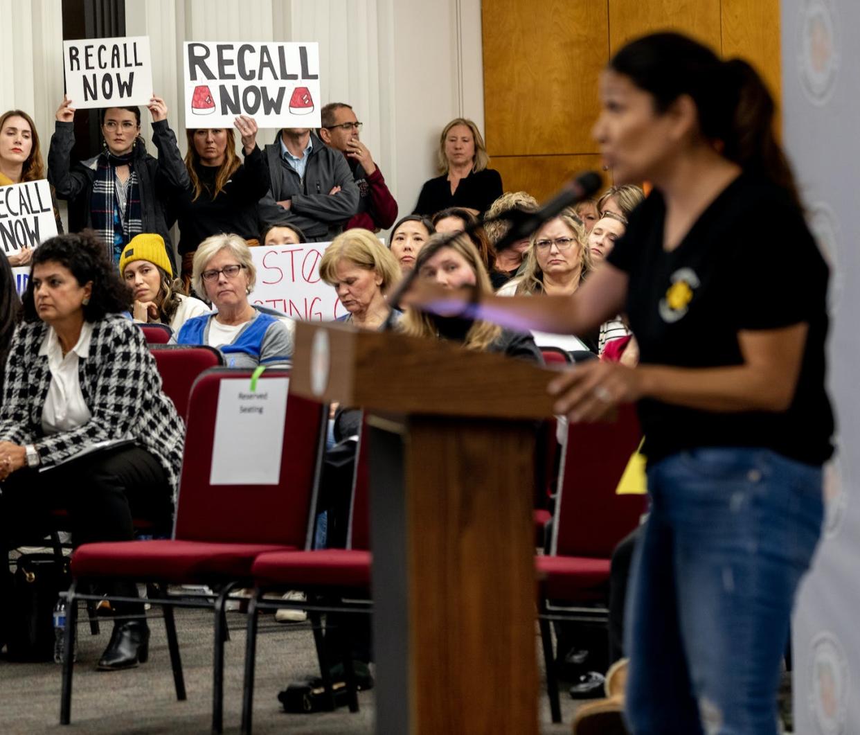 A crowd of parents in Orange County, Calif., protest the firing of Superintendent Gunn Marie Hansen. <a href="https://www.gettyimages.com/detail/news-photo/concerned-parent-jessica-nettles-speaks-in-front-of-large-news-photo/1246397773?adppopup=true" rel="nofollow noopener" target="_blank" data-ylk="slk:Gina Ferazzi / Los Angeles Times via Getty Images;elm:context_link;itc:0;sec:content-canvas" class="link ">Gina Ferazzi / Los Angeles Times via Getty Images</a>