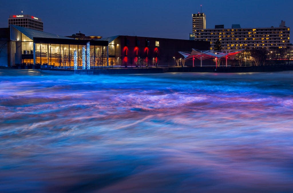 A 2018 photo shows the South Bend River Lights display illuminating the churning waters of the St. Joseph River. A new city policy increases the number of businesses that stand to benefit from cheaper liquor licenses offered within a certain distance of the river.