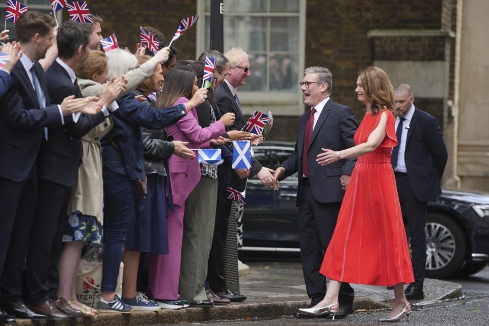 Britain's Labour Party Prime Minister Kier Starmer and his wife Victoria arrive in Downing Street and greet supporters in London, Friday, July 5, 2024. Labour leader Stammer won the general election on July 4, and was appointed Prime Minster by King Charles III at Buckingham Palace, after the party won a landslide victory. (AP Photo/Kin Cheung)