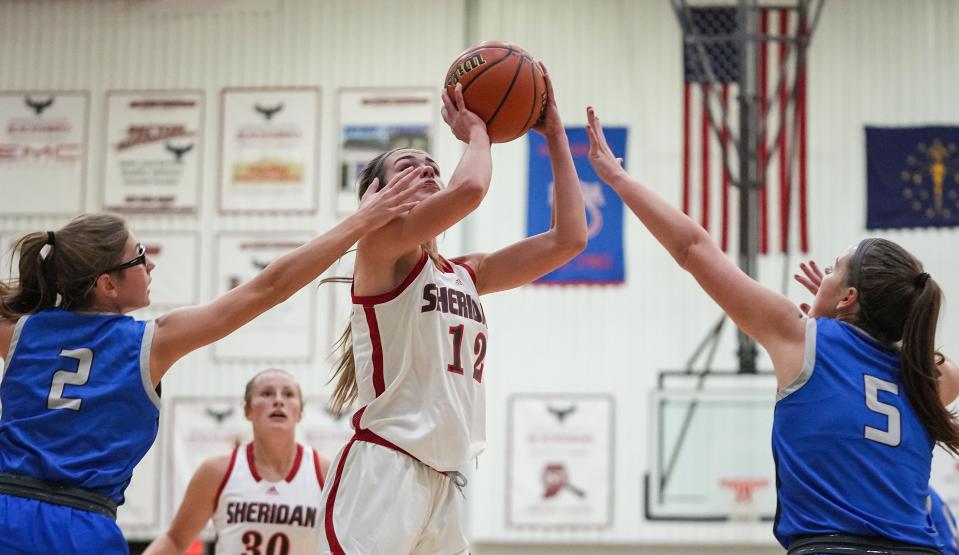 Sheridan Blackhawks Kenzie Garner (12) attempts a lay-up Thursday, Nov. 9, 2023, during the game at Sheridan High School in Sheridan. The Carroll Cougars defeated the Sheridan Blackhawks, 48-44.