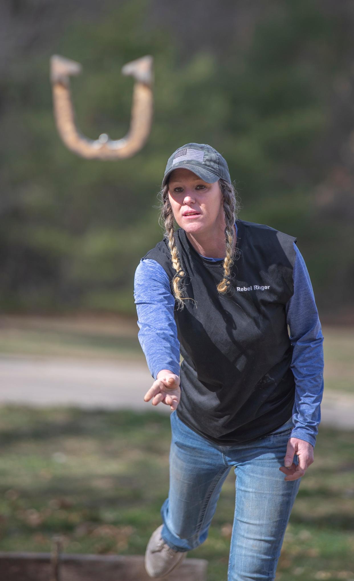 Paula Schwerdtfeger, 47, practices her passion of horseshoe throwing at her home in Waupaca, Wisconsin on Tuesday, April 9, 2024. Gabi Broekema/USA TODAY NETWORK- Wisconsin