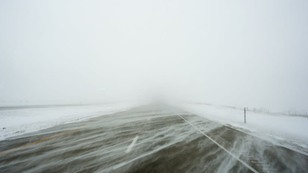 A snowy US Highway 20 is seen during a blizzard near Galva, Iowa, Saturday, Jan. 13, 2024. (AP Photo/Carolyn Kaster)
