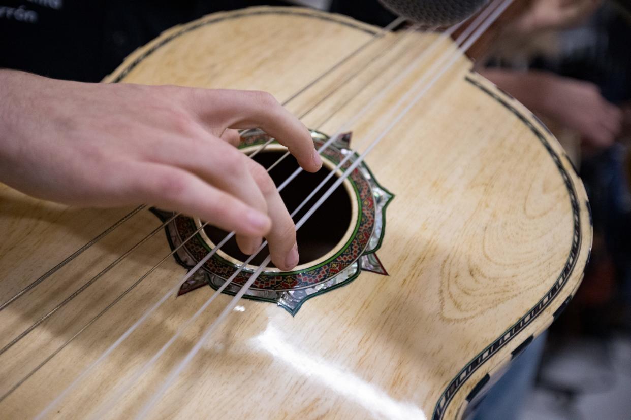 Diego Leon, a student at Franklin High School, plays la Guitar de Golpe at rehearsal on Friday, Feb. 9, 2024. Mariachi Estrella Del Oeste is one of the four El Paso Independent School District high schools that have secured spots in the 2024 UIL State Mariachi Festival.